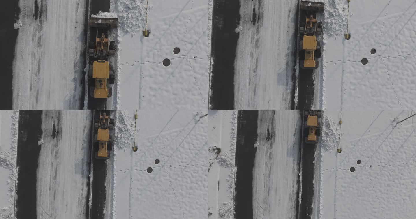 航拍俯瞰威海市双岛湾清雪除冰铲车
