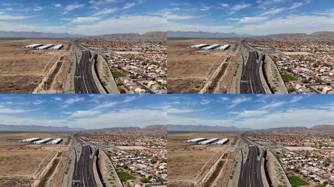 公路鸟瞰图，背景是山脉，亚利桑那州凤凰城202号公路，埃斯特雷拉山脉和南山，蓝天和白云