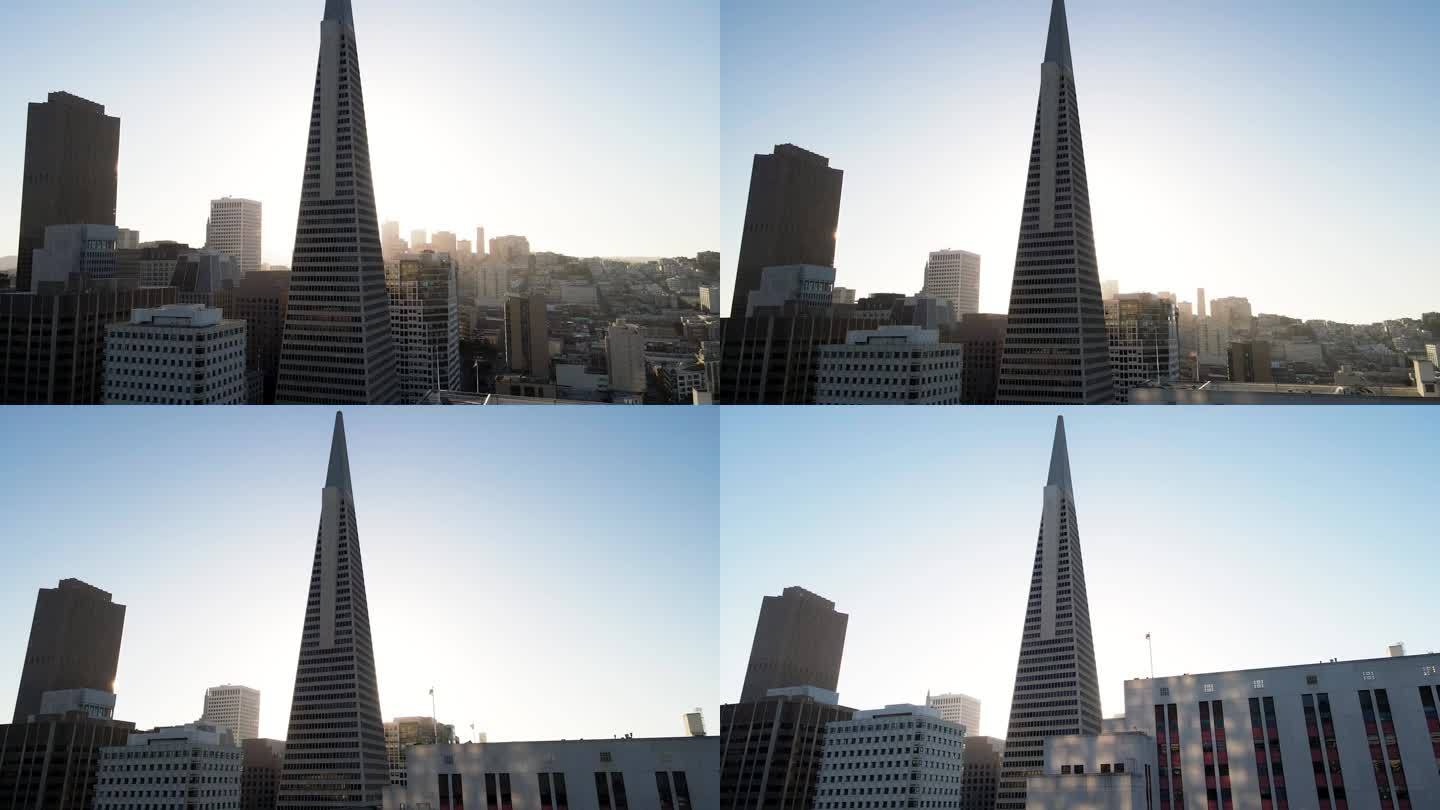 现代城市天际线的鸟瞰图，沐浴在柔和的阳光下，摩天大楼和清澈的蓝天。这段无人机拍摄的视频拍摄了泛美金字
