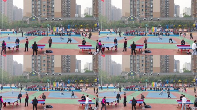 街道社区运动场上运动打球的男女老少市民