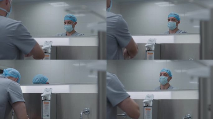 穿制服的医生在手术前洗手