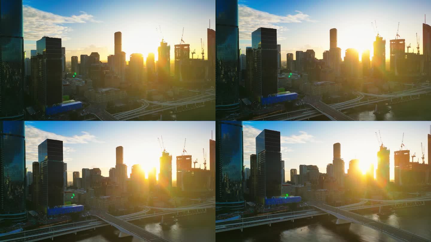 鸟瞰图:日出时分，澳大利亚昆士兰州布里斯班，维多利亚桥和库克船长桥上的布里斯班河，现代办公大楼旁的实