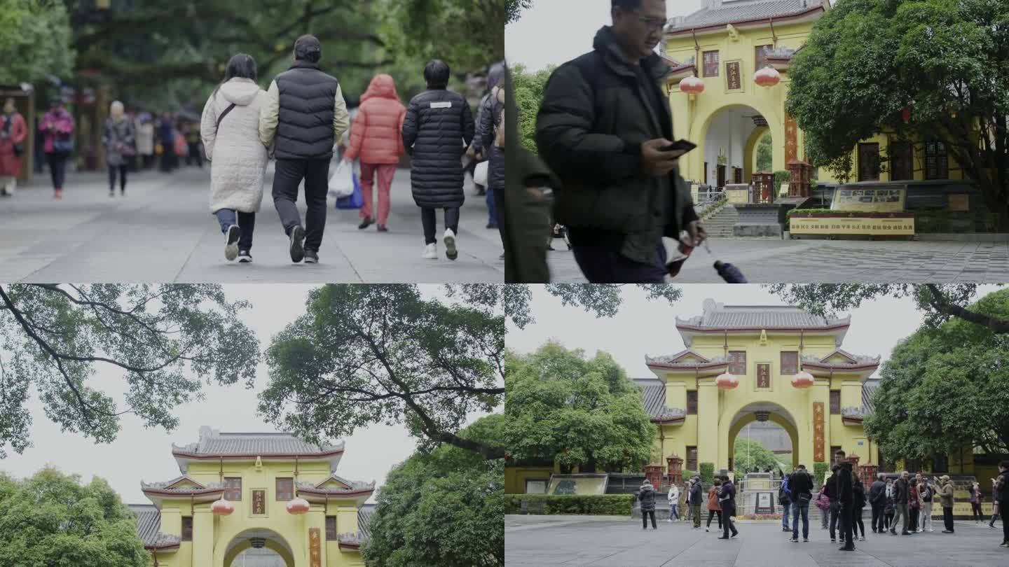 广西靖江王府大门前来来往往拍照打卡的游客