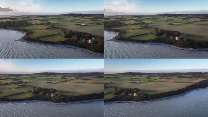 Isel Møn海景景观的航拍镜头，以新兴的Møn灯塔为特色，其醒目的黄色塔楼，白色的画廊和充满活力