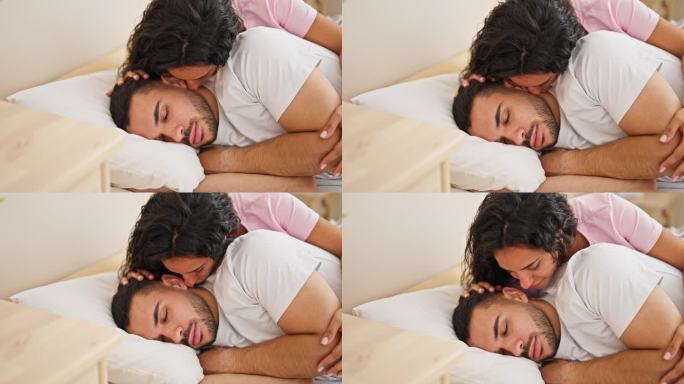 一对男女在卧室睡觉时亲吻男友