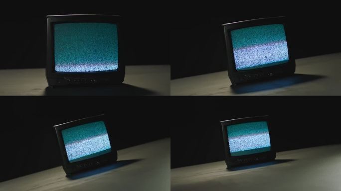 一个黑色背景桌子上的无信号电视的上升画面