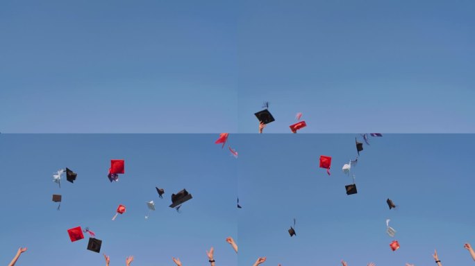 毕业生们在蓝天下抛着五颜六色的帽子。