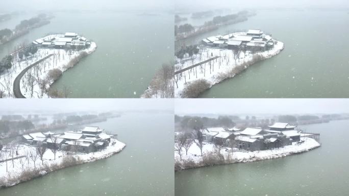 航拍北湖湿地公园雪景湖泊古建筑江南下雪