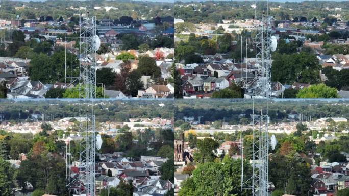 空中视差与秋天的城市景观郊区为背景。住宅区上方的电信信号塔。