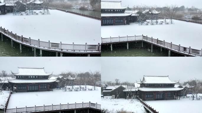 航拍北湖湿地公园雪景湖泊古建筑江南下雪