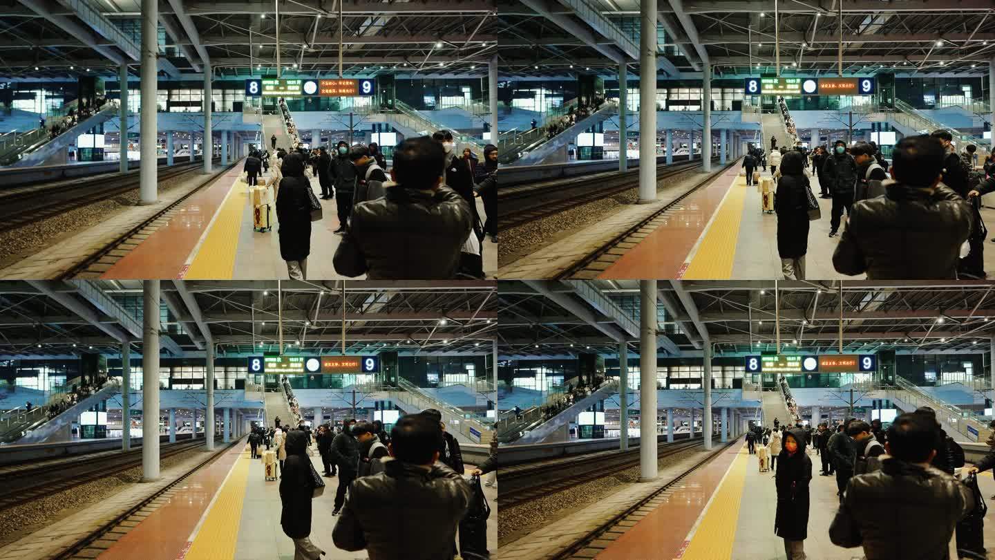 火车站站台上等候上车的乘客和动车高铁进站