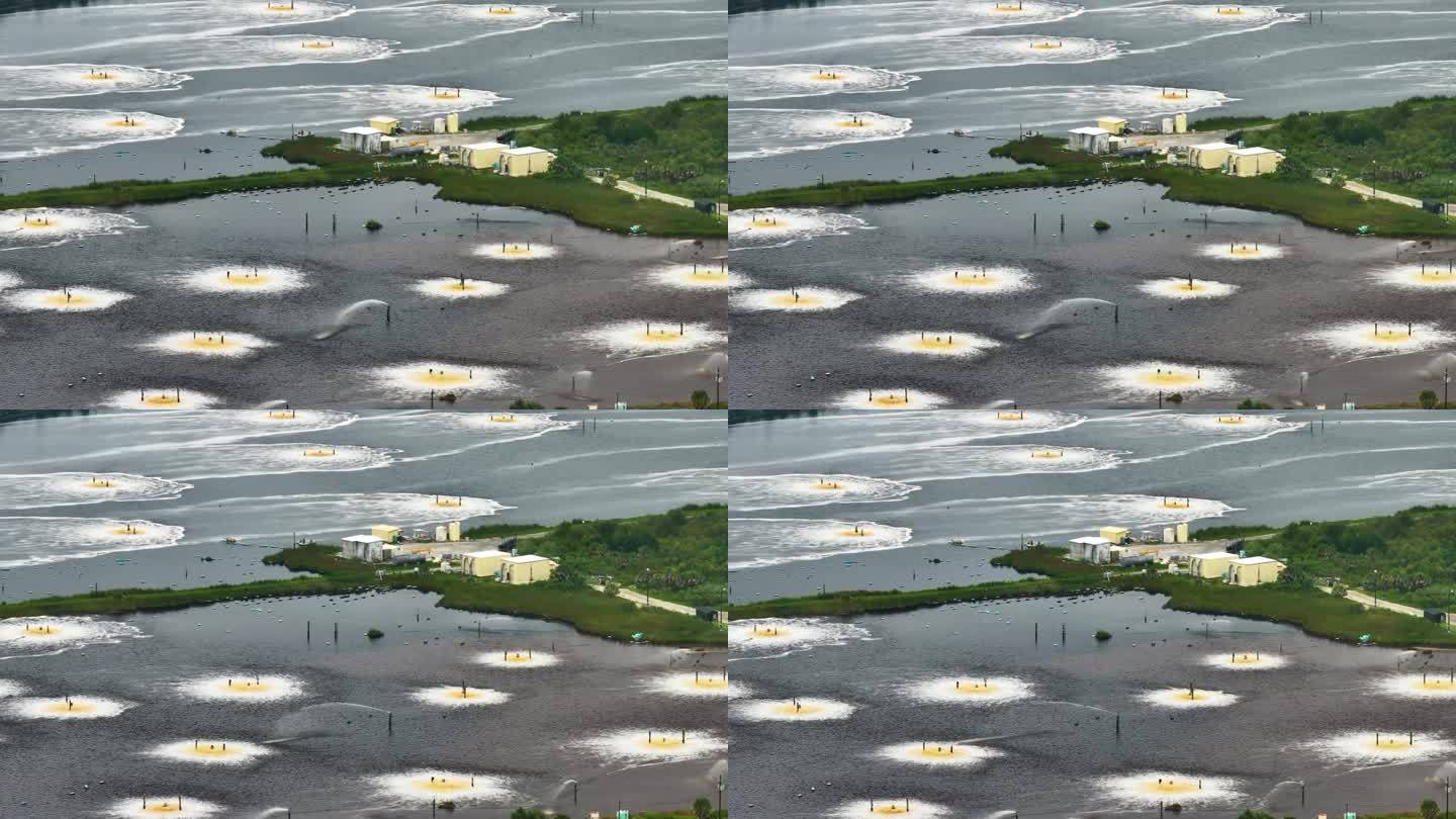 美国乔治亚州布伦瑞克纤维素和造纸厂工业沉淀物曝气池鸟瞰图。现代工业对环境的有害影响
