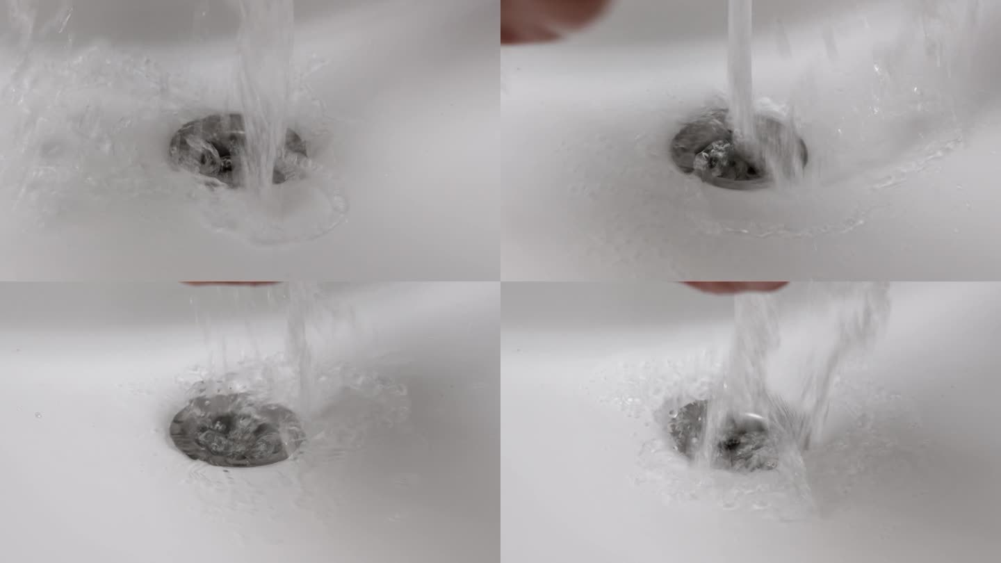 一名男子在浴室白色的水池中用飞溅的清水洗手