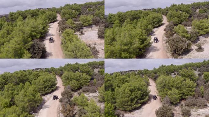 克罗地亚Blaca Hermitage附近，在植被中驾驶越野车的上坡土路。航拍跟踪拍摄