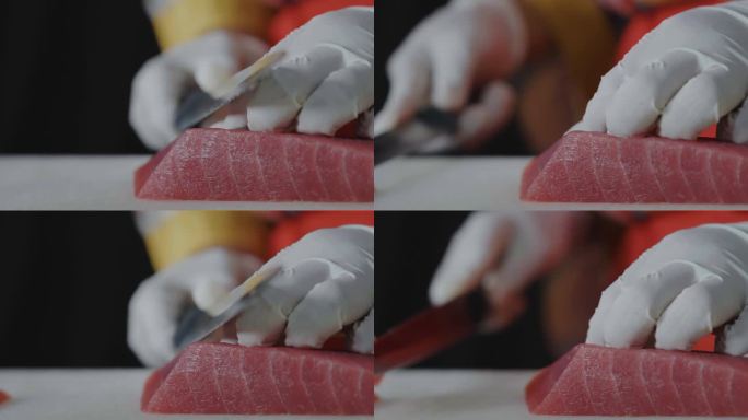 女厨师手用鱼片刀切新鲜的金枪鱼肉在菜板上，厨师准备健康菜单三文鱼生鱼片或寿司给顾客，日本料理食谱。