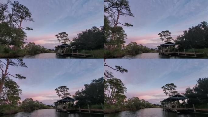 阿拉巴马州奥兰治海滩10月的下午——日落时分回家，蜻蜓在运河上空飞舞