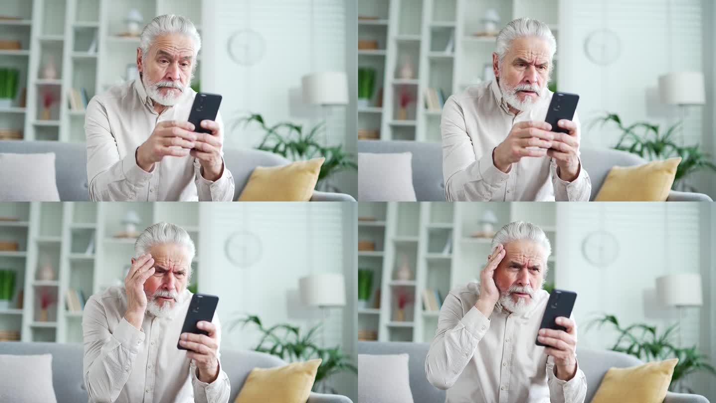 沮丧的白发老人坐在家里客厅的沙发上用智能手机看坏消息。
