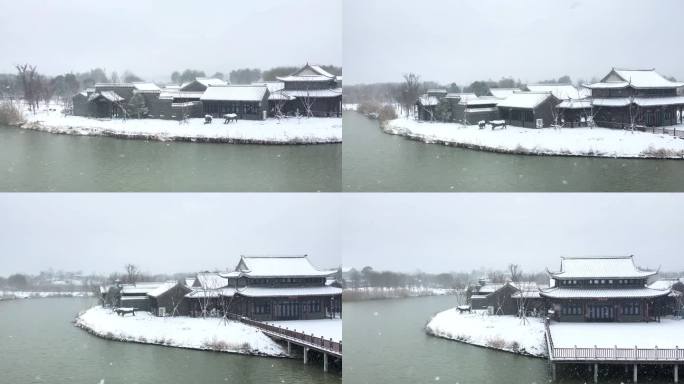 航拍北湖湿地公园雪景湖泊古建筑江南下雪