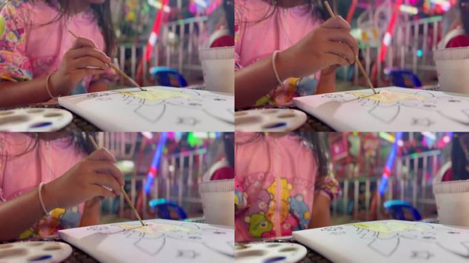 8岁的小女孩在画画和上色