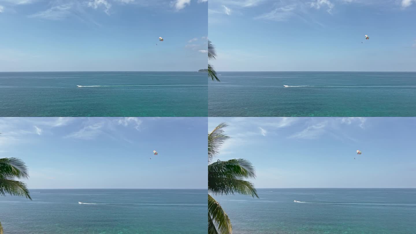 泰国海岸一个阳光明媚的日子，海滩上的娱乐活动——摩托艇后面有降落伞，人们在海面上跳伞