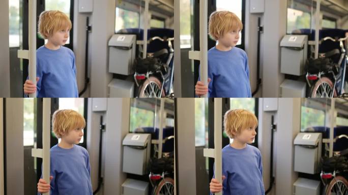 青春期前的男孩在地铁车厢或火车上旅行。一个孩子看着火车窗外的风景。一辆通勤火车开动时，一名年轻乘客紧