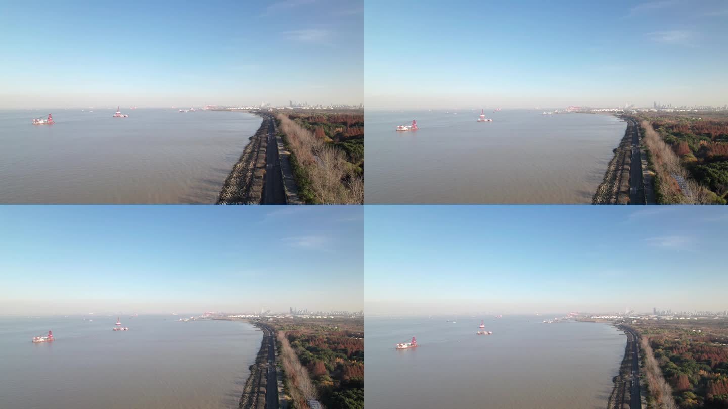 无人机拍摄的船只在靠近大海的河流上航行，高角度视角，上海港在长江入海口，4k实时镜头。