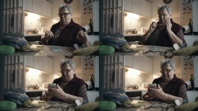 肥胖老年妇女在家吃饭时换眼镜用智能手机