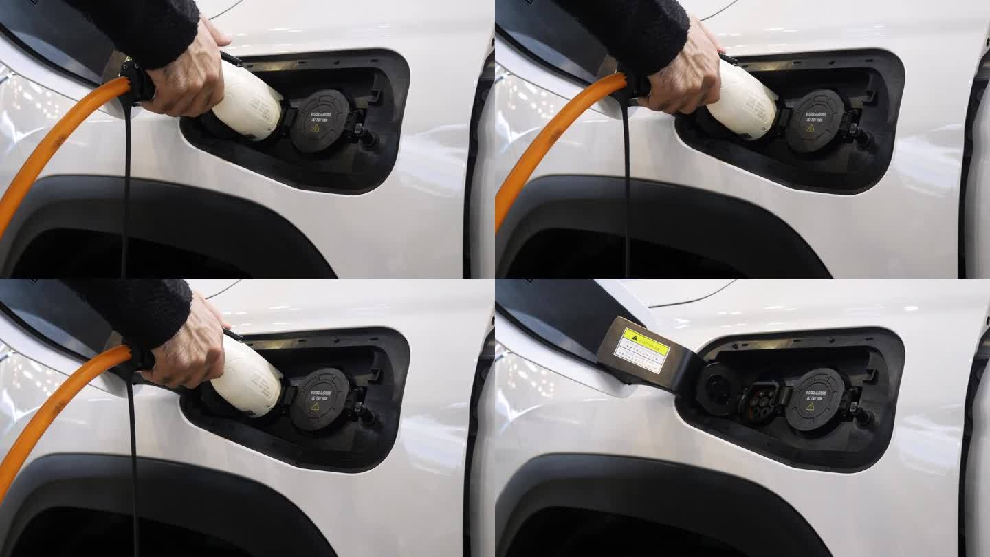给电动汽车充电。媒体。一辆白色的汽车停在一个专门为电动汽车充电的加油站。高品质4k画面