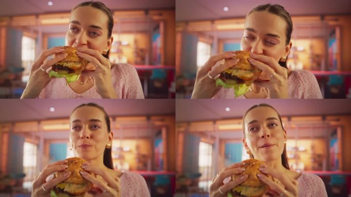 跟踪一个正在家里享受美味汉堡的女人的慢动作肖像。一个快乐的女性点了一份快餐，在五彩缤纷的环境中，她对