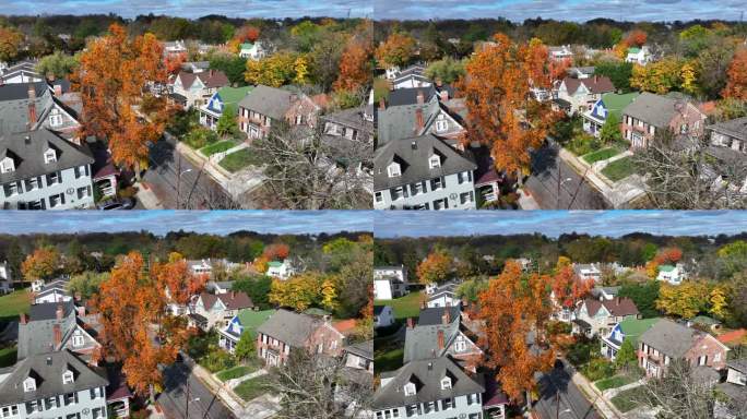 在新英格兰地区的美国小镇郊区，五颜六色的秋天树木。空中的视角。