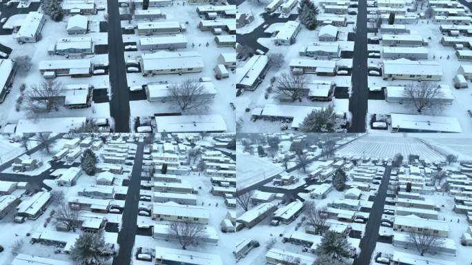 活动房屋拖车公园在冬天被雪覆盖。农村低收入住房航拍图。