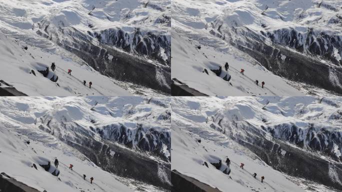 攀登乌库楚雪山的登山者大雪中徒步行进