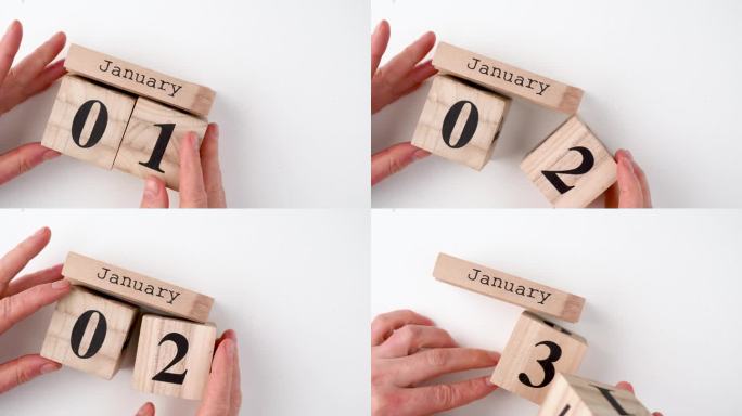 1月1日。月的第一天，木制背景的日历。冬天的时候，新年的概念