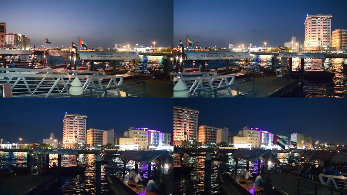 迪拜，阿联酋——2016年12月12日:夜晚，迪拜河上的船只载着游客
