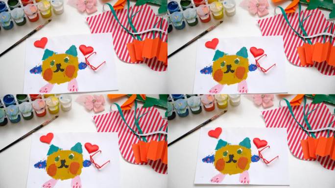 小朋友画可爱的小猫、爱心、用纸做工艺品。手工概念的生日，母亲节或情人节。教育。灵感和想象力