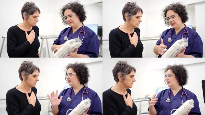 医生向一位妇女解释便携式紧急除颤器的工作原理