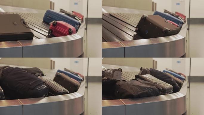 乘飞机旅行。旅客在机场候机楼领取行李。机场候机楼的行李传送带上的轮式行李箱。行李传送带。