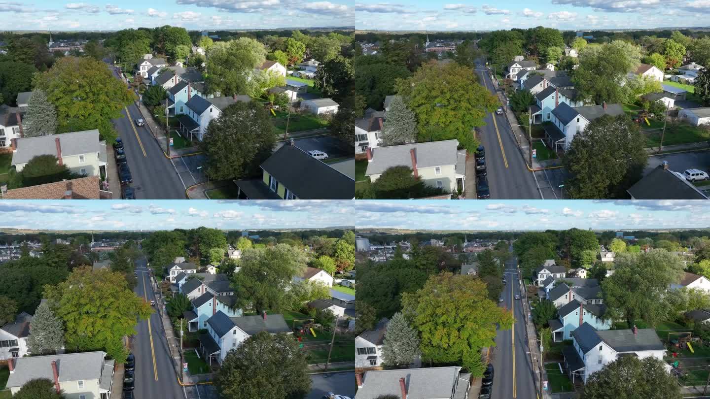 小镇社区附近的两层住宅。安静的街道上的汽车。拍摄于美国东北部。