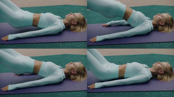 年轻的运动女子在瑜伽垫上做臀肌桥练习