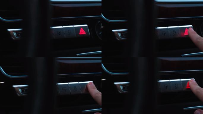 红色紧急按钮闪烁现代豪华轿车内部。详细介绍自动变速箱换挡，多媒体控制系统，汽车控制面板，通风口和仪表