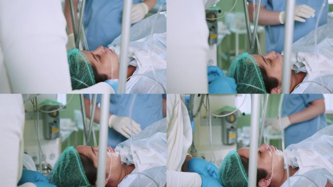 手术中病人的特写。现代手术室里，一名妇女躺在手术台上，全身麻醉，还戴着呼吸管。专业的外科医生使用腹腔