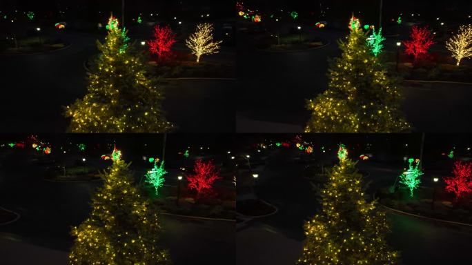 航空轨道拍摄的点亮圣诞树和圣诞装饰沿着美国的道路。