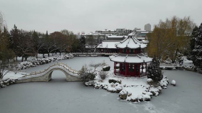 4k航拍古建筑雪景保定古莲花池雪景