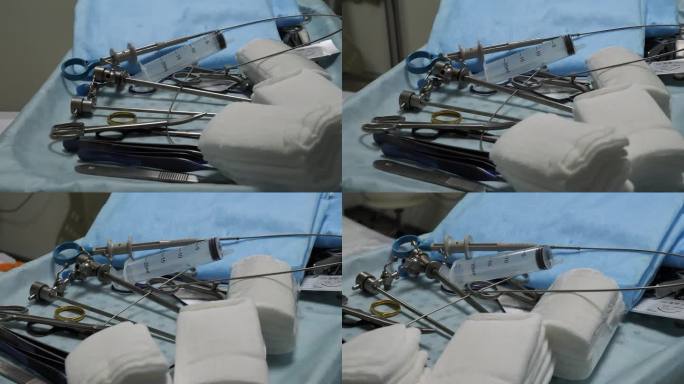 外科医生准备开始手术，蓝色背景的无菌器械躺在手术台上。手术器械概念。