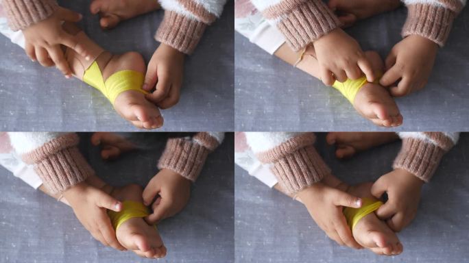 弹性治疗黄色胶布应用于儿童腿部。Kinesio
