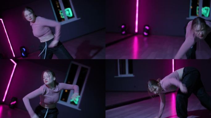住相机。一个跳当代舞的天才女孩。一个年轻的舞者在舞蹈大厅里用霓虹灯照亮的镜子。