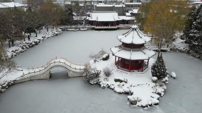 4k航拍古建筑雪景保定古莲花池雪景