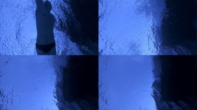 从池底拍摄的白人运动员爬泳的特写镜头