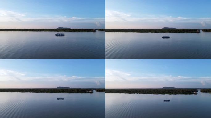 柬埔寨湖上的废船在日落时，无人机升起