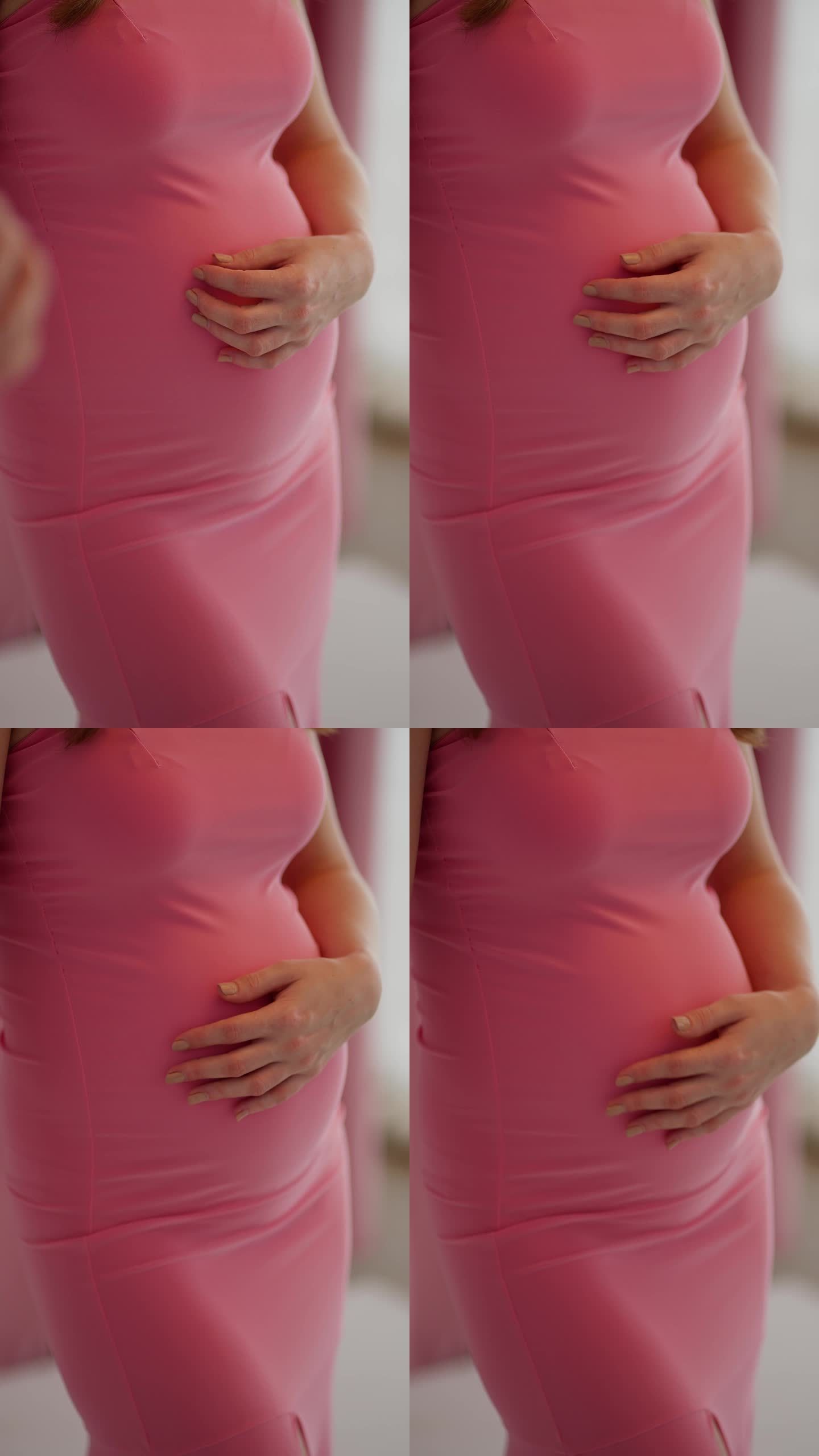 一位孕妇用手捂着肚子